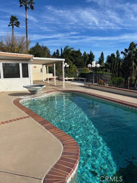 18772 Algiers Street Porter Ranch, CA 91326 - Photo 16 of 22 a front view of a house with a garden