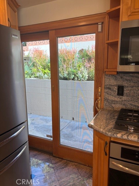 18772 Algiers Street Porter Ranch, CA 91326 - Photo 7 of 22 a kitchen with a stove and a wooden floor