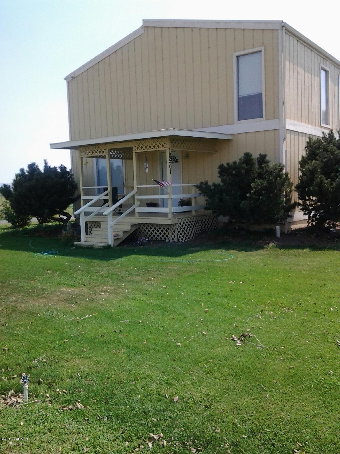 a house view with a garden space