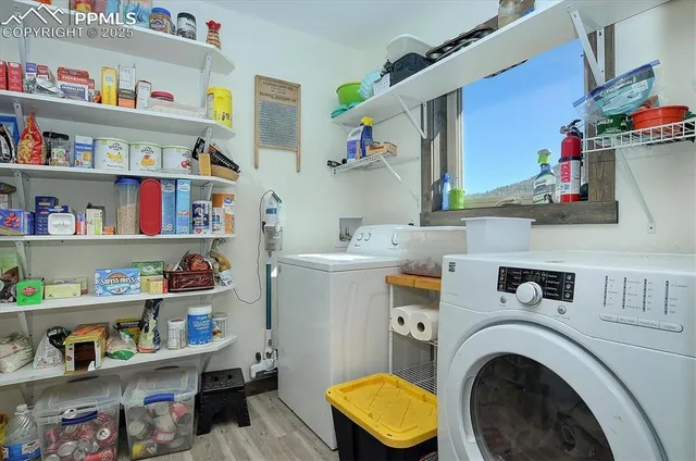 a utility room with sink dryer and washer
