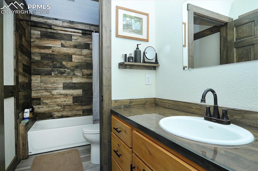 1115 Eagles Gate Road Westcliffe, CO 81252 - Photo 18 of 49 a bathroom with a sink and a mirror