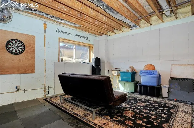 a living room with furniture and a table