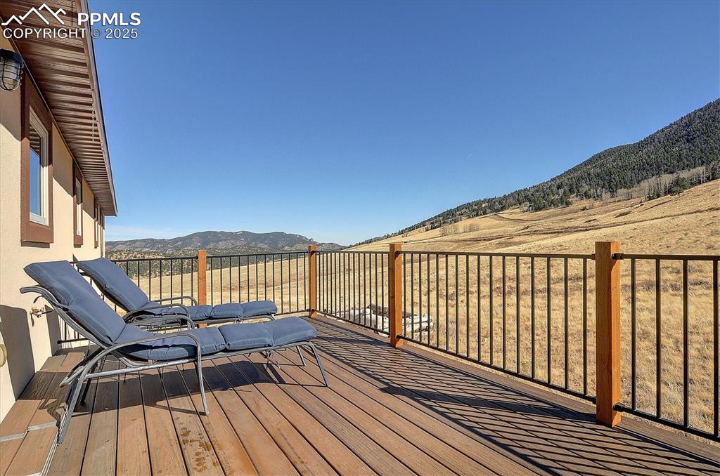 1115 Eagles Gate Road Westcliffe, CO 81252 - Photo 35 of 49 a view of balcony with wooden floor and seating space