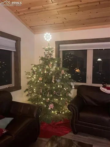a view of room with wooden floor and a window