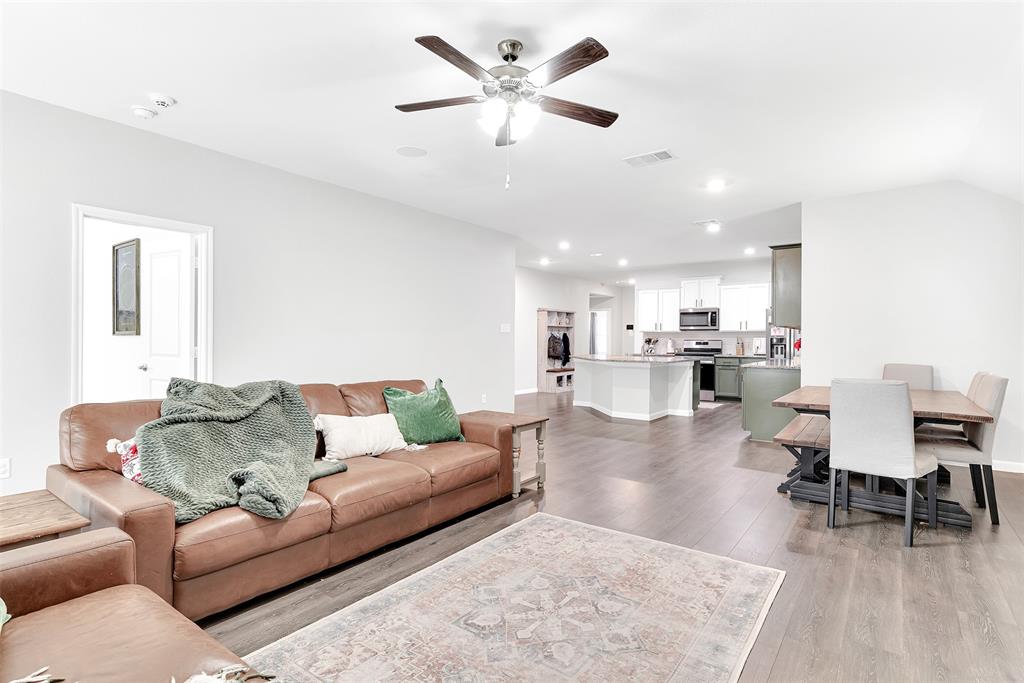 707 Range Drive Princeton, TX 75407 - Photo 12 of 29 a living room with furniture and kitchen view