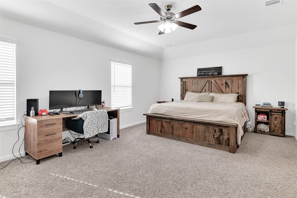 707 Range Drive Princeton, TX 75407 - Photo 13 of 29 a bedroom with a bed and a couch