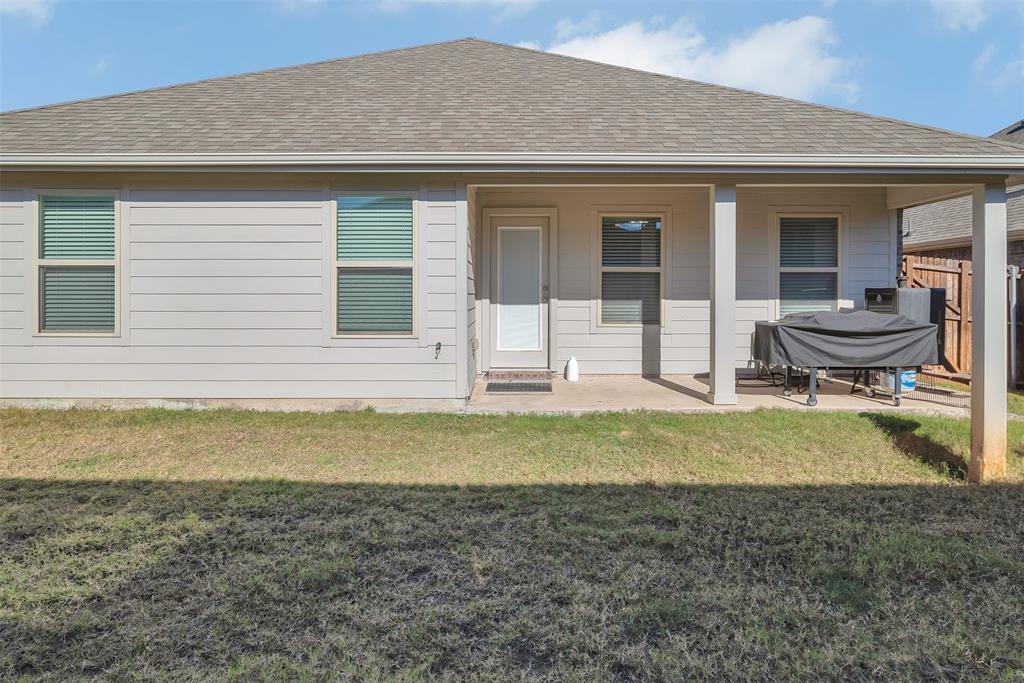 707 Range Drive Princeton, TX 75407 - Photo 23 of 29 a view of swimming pool with lawn chairs and wooden fence