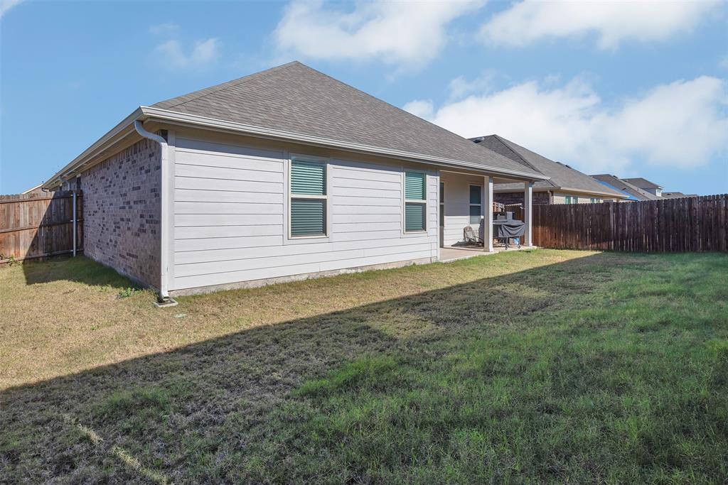 707 Range Drive Princeton, TX 75407 - Photo 24 of 29 a front view of a house with garden