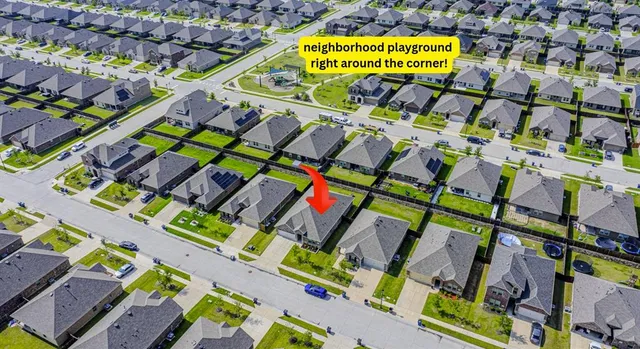 a view of multiple houses with outdoor space