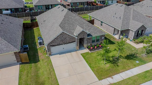 a aerial view of a house with a yard