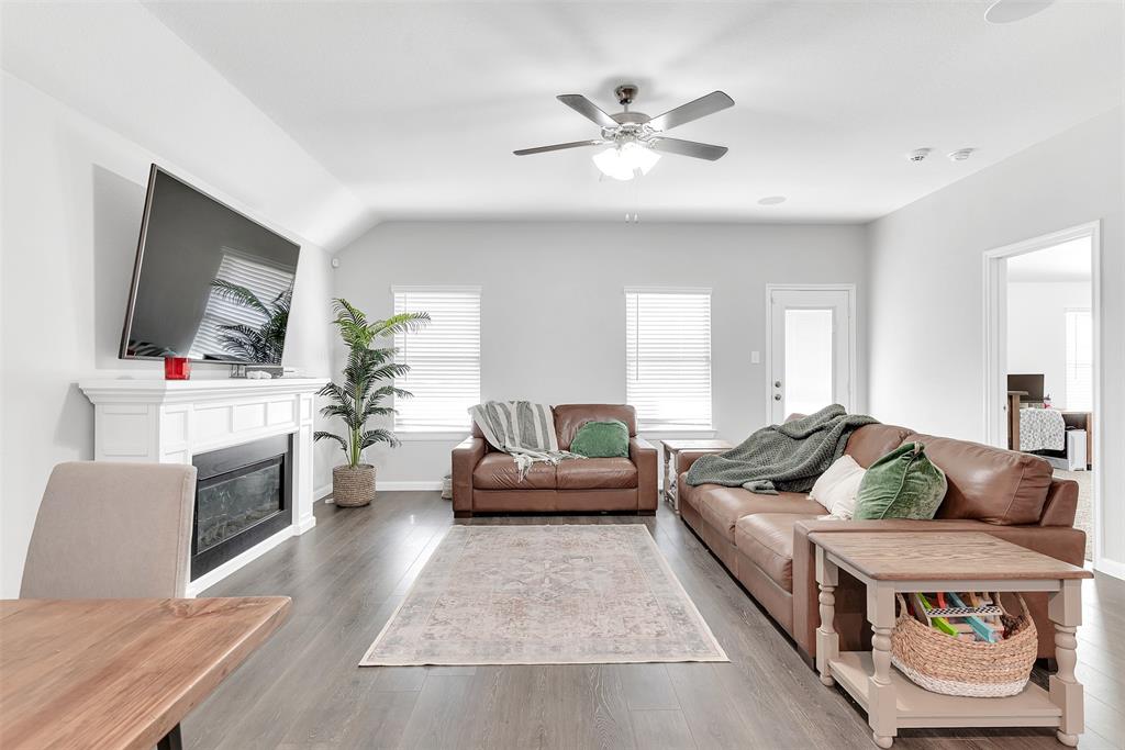 707 Range Drive Princeton, TX 75407 - Photo 10 of 29 a living room with furniture and a flat screen tv