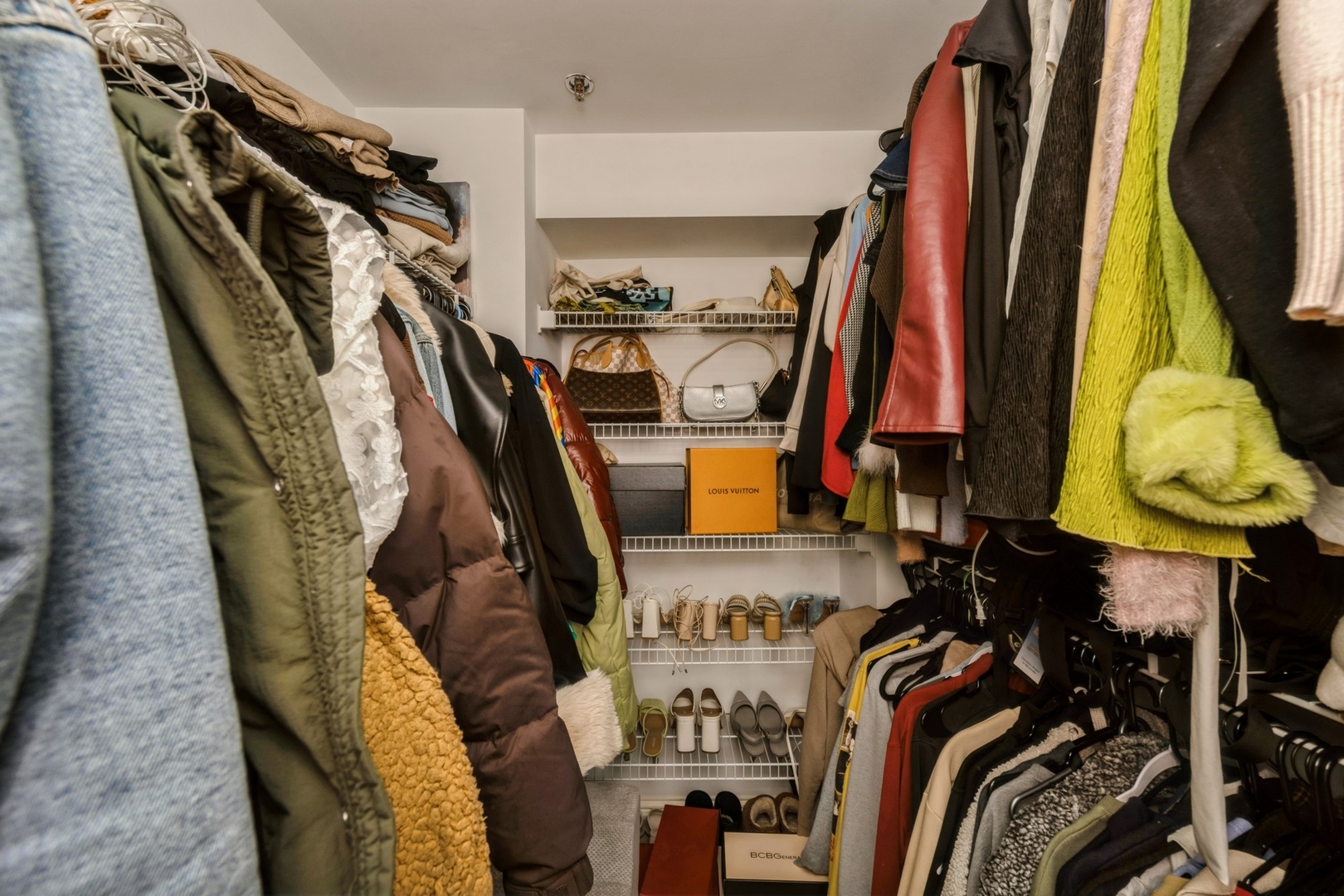 25 East Superior Street, Unit 1801 Chicago, IL 60611 - Photo 11 of 23 a view of walk in closet with clothes and shoes