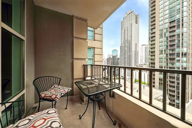 a view of a balcony with chair and the potted plant