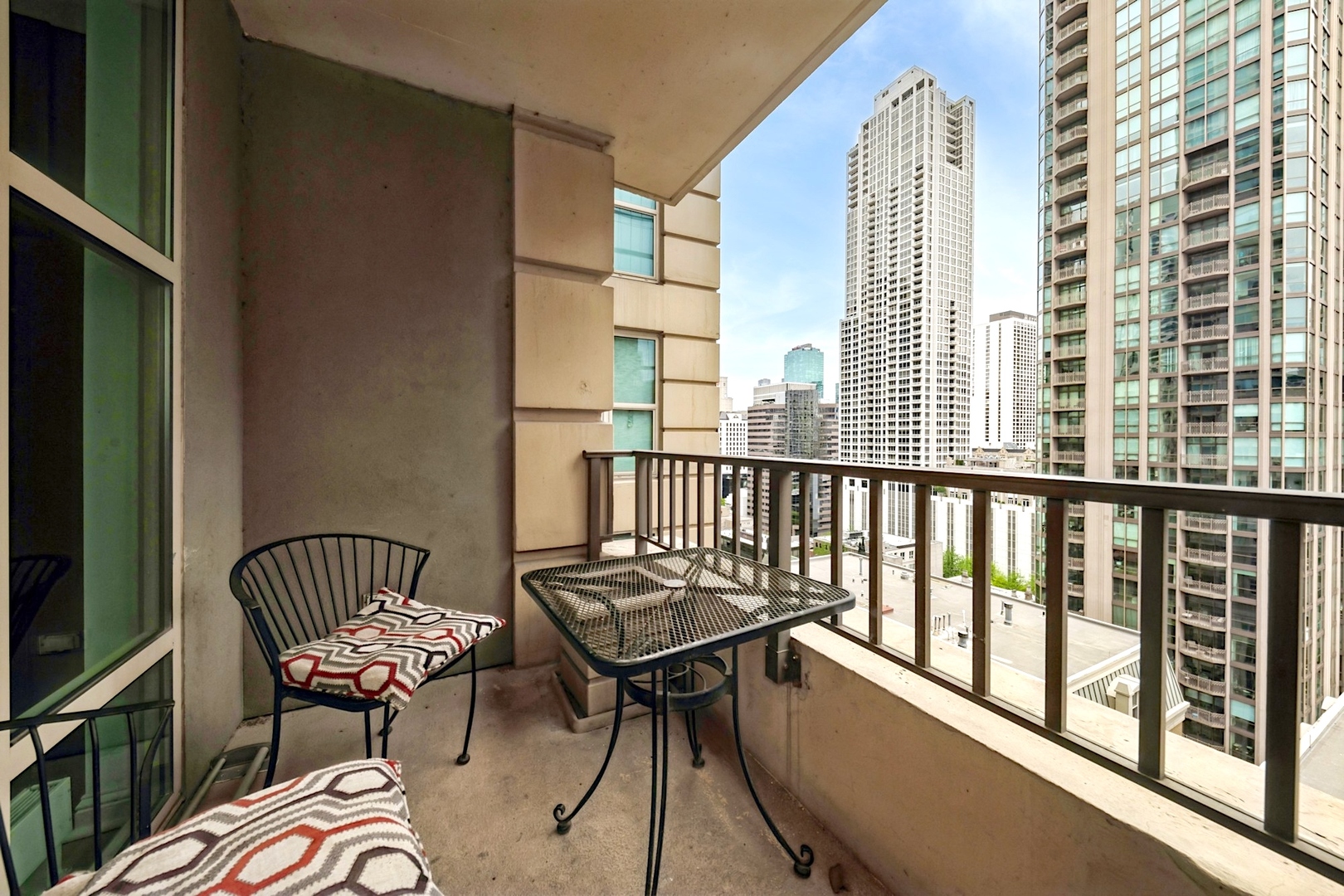 25 East Superior Street, Unit 1801 Chicago, IL 60611 - Photo 15 of 23 a view of a balcony with chair and the potted plant