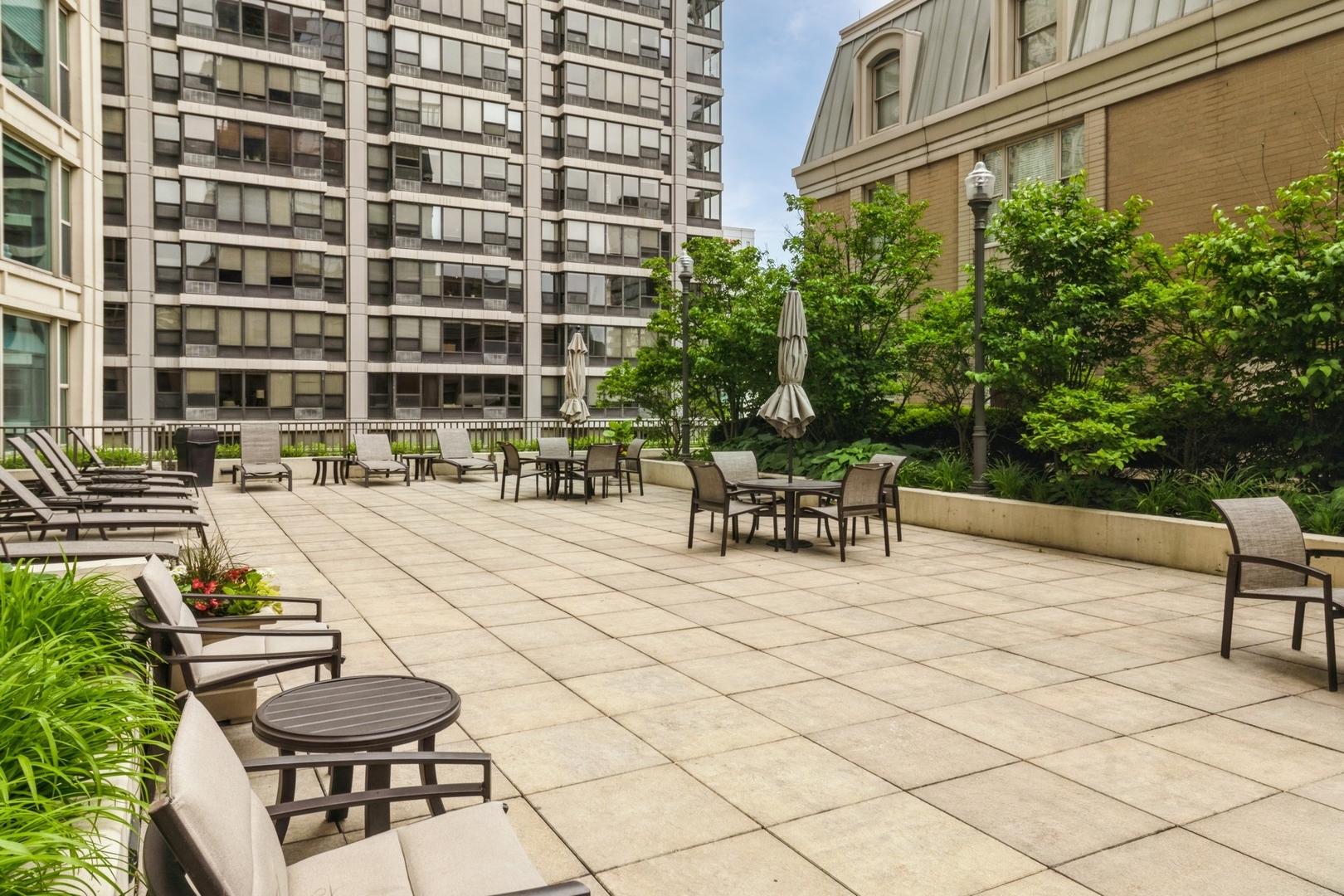 25 East Superior Street, Unit 1801 Chicago, IL 60611 - Photo 17 of 23 a swimming pool with outdoor seating and yard