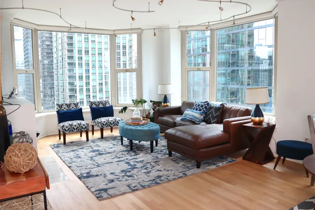 a living room with furniture and a large window