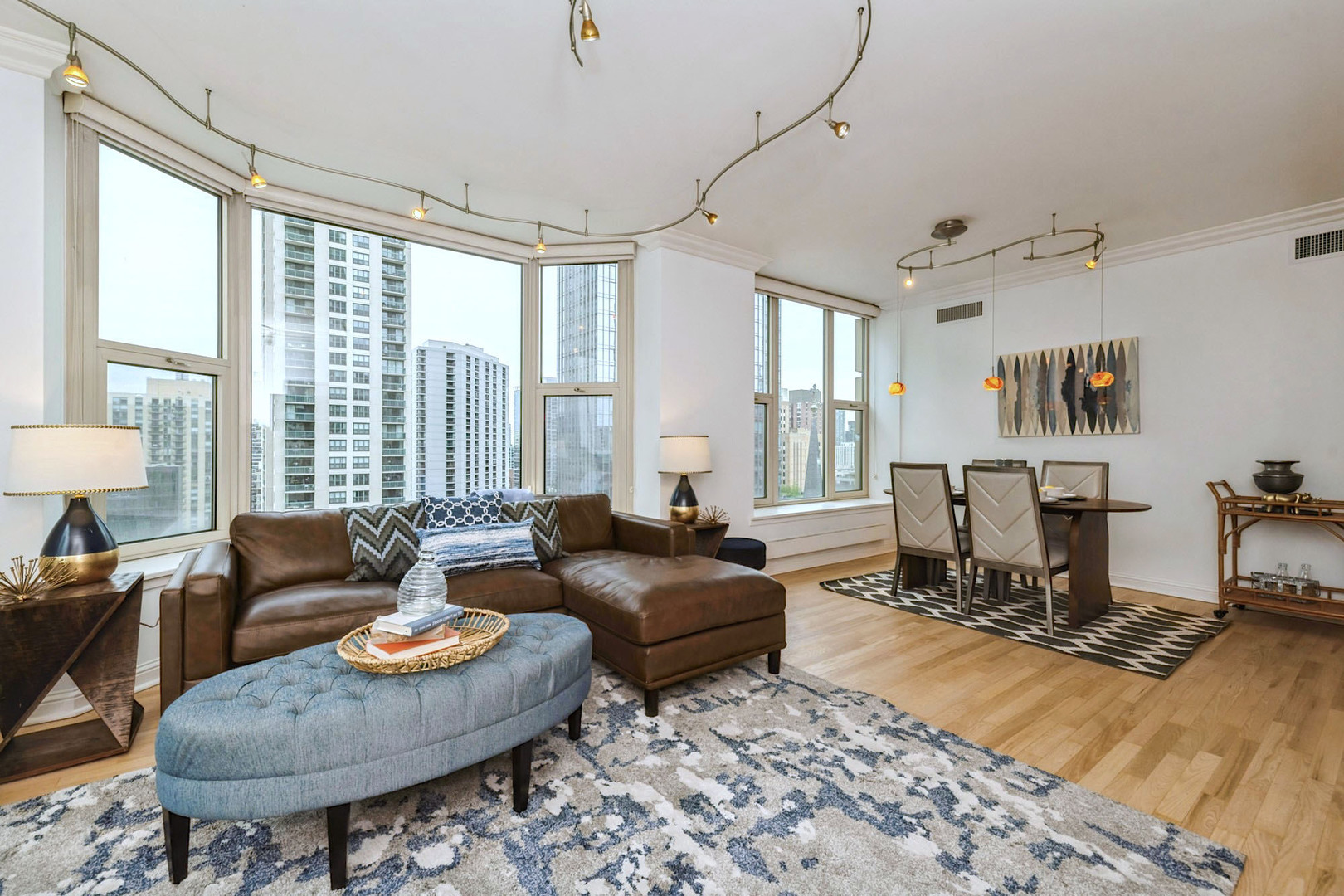 25 East Superior Street, Unit 1801 Chicago, IL 60611 - Photo 4 of 23 a living room with furniture and a large window