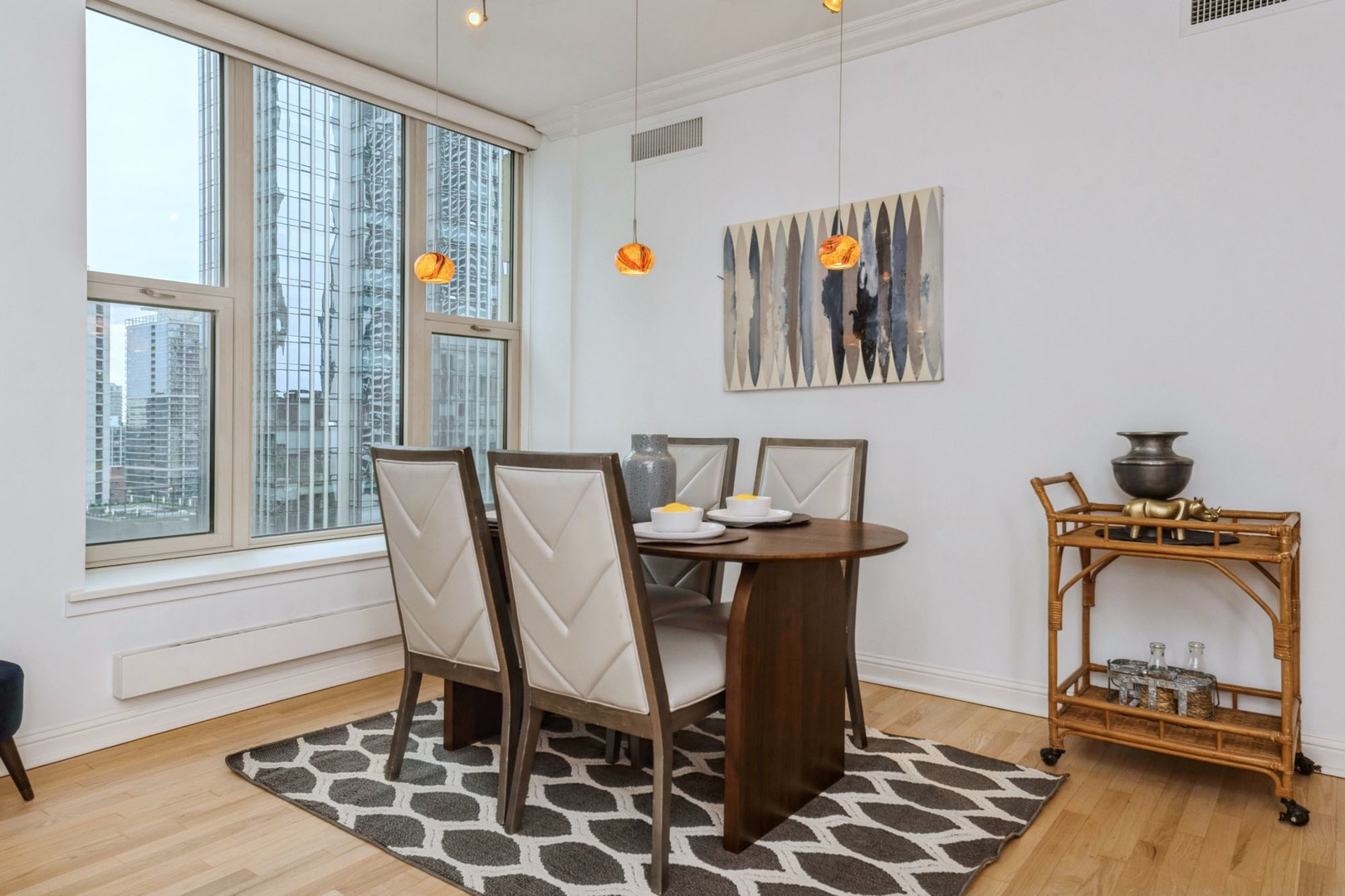 25 East Superior Street, Unit 1801 Chicago, IL 60611 - Photo 5 of 23 a view of a workspace with furniture and a window