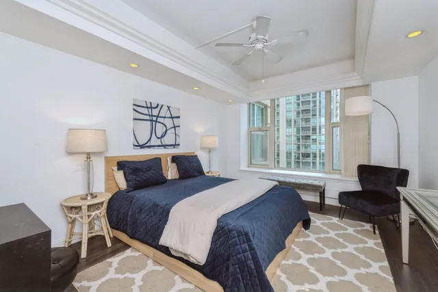 a bedroom with bed and a window