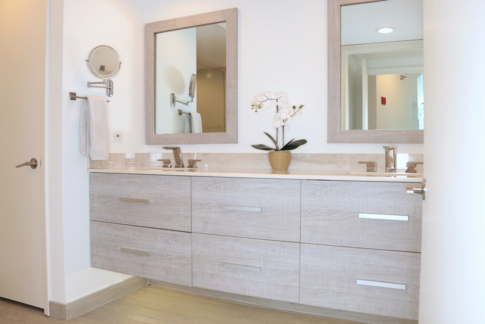 25 East Superior Street, Unit 1801 Chicago, IL 60611 - Photo 9 of 23 a bathroom with a sink and a mirror