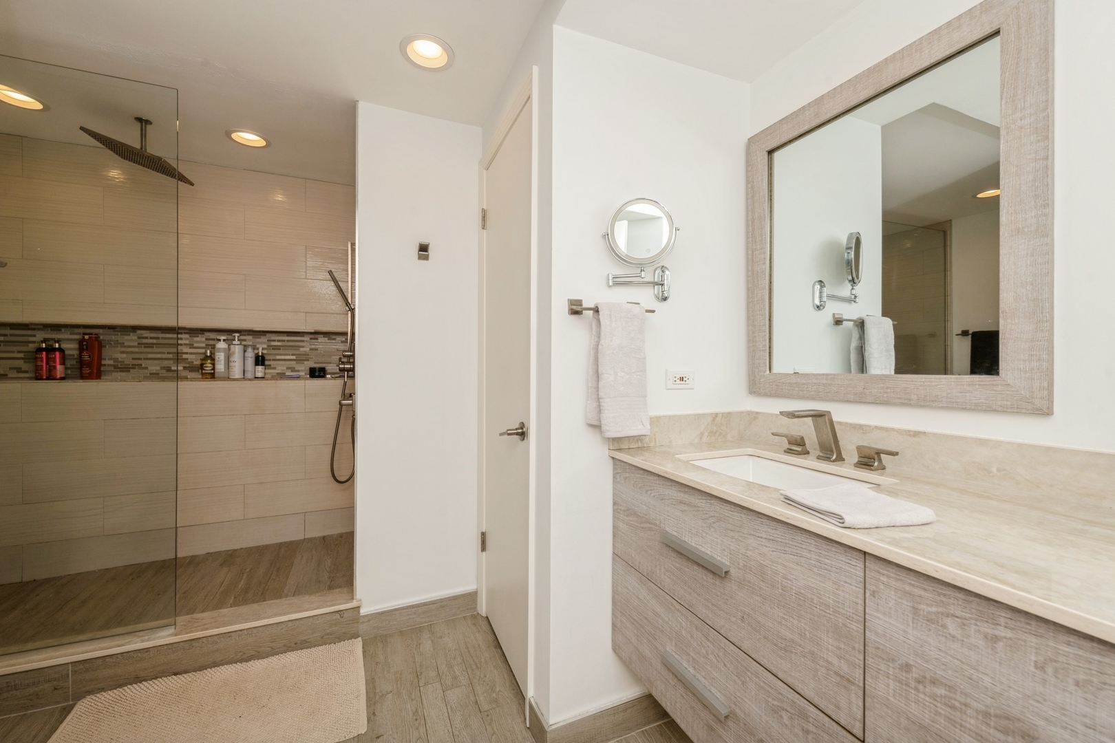25 East Superior Street, Unit 1801 Chicago, IL 60611 - Photo 10 of 23 a bathroom with a granite countertop sink mirror and shower