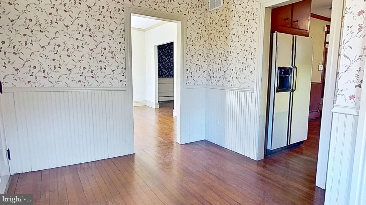 1447 Park Road Spring Grove, PA 17362 - Photo 6 of 13 a view of a hallway with wooden floor and brick wall