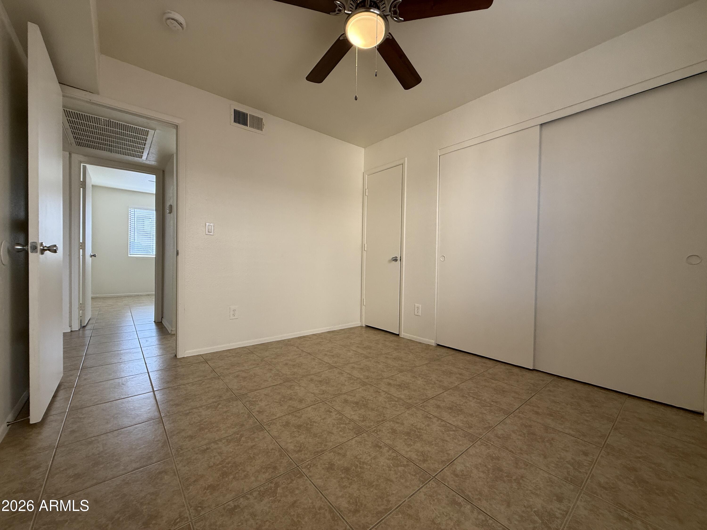 2650 East McKellips Road, Unit 105 Mesa, AZ 85213 - Photo 12 of 13 a view of empty room with wooden floor