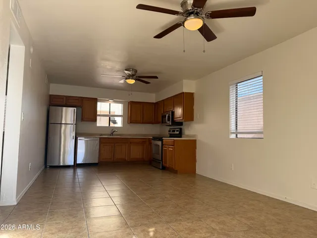 a kitchen with granite countertop a sink and counter top space