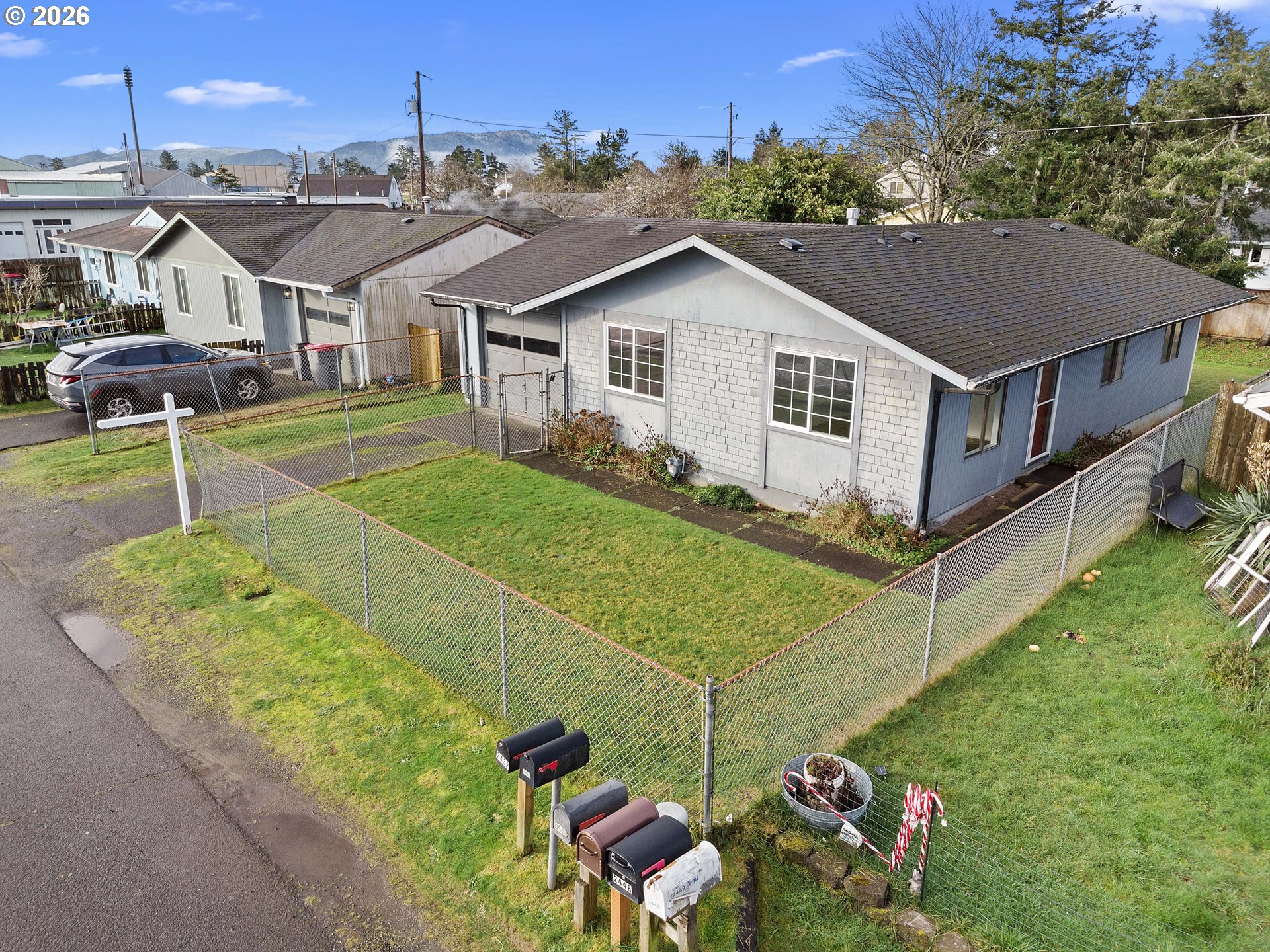 a view of a house with a backyard and porch