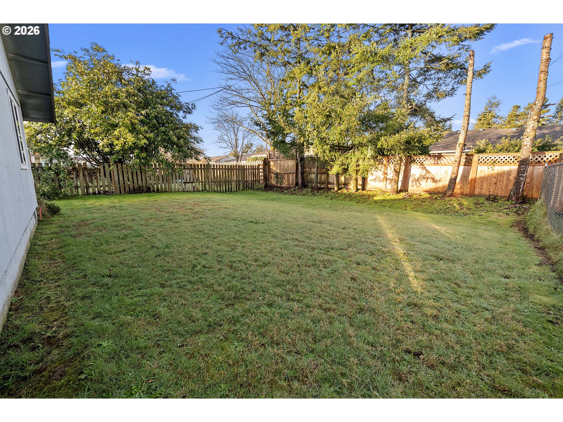 2440 Pine Street Seaside, OR 97138 - Photo 16 of 22 a view of a field with large trees