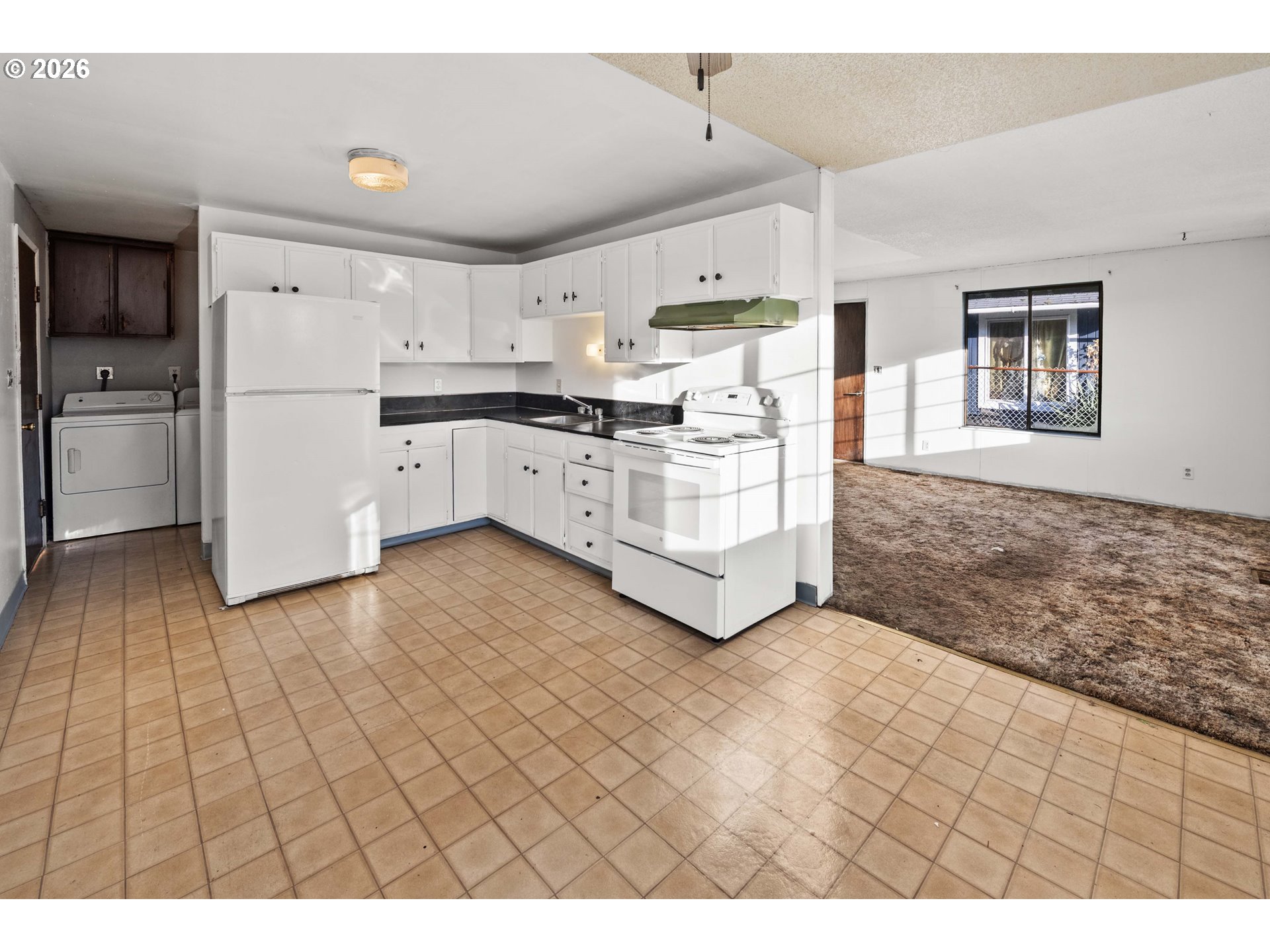 2440 Pine Street Seaside, OR 97138 - Photo 6 of 22 a kitchen with stainless steel appliances a refrigerator and a stove