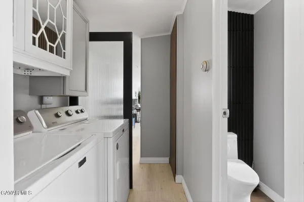 a kitchen with a refrigerator sink and stove