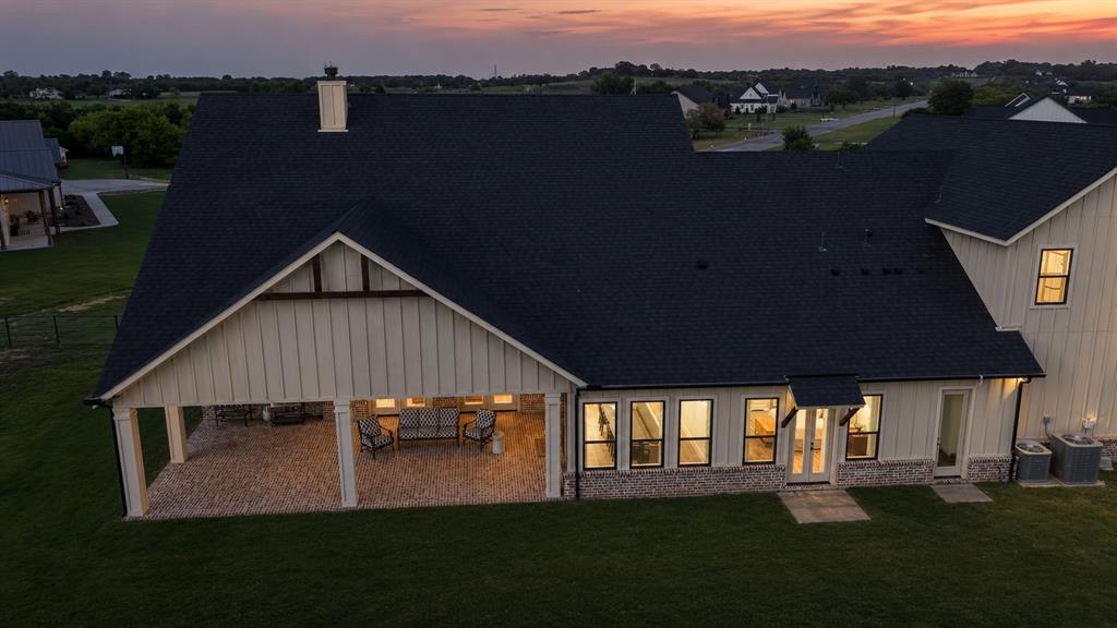 985 Vest Lane Pilot Point, TX 76258 - Photo 9 of 40 Expansive covered patio with a textured flooring surface