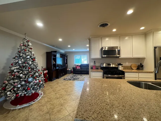 a kitchen with a refrigerator and a sink