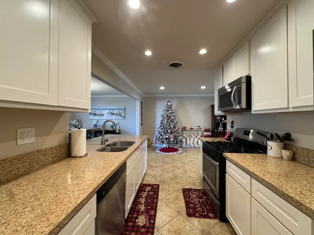 a kitchen with a stove and a sink