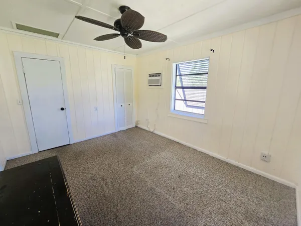 a bathroom with a sink a toilet a mirror and bathtub