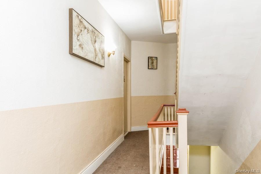 41-32 53rd Street Queens, NY 11377 - Photo 22 of 24 a view of hallway with stairs