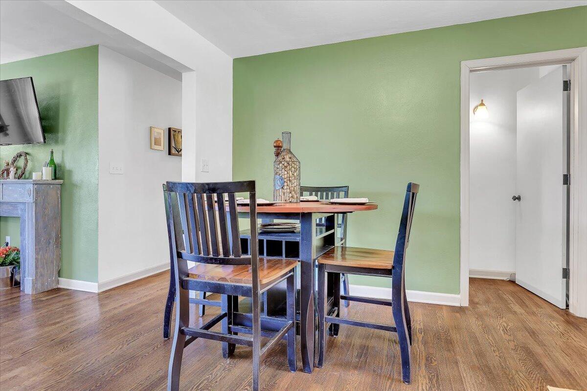 1390 Blue Ridge Springs Road Blue Ridge, VA 24064 - Photo 13 of 54 a view of a dining room with furniture and wooden floor