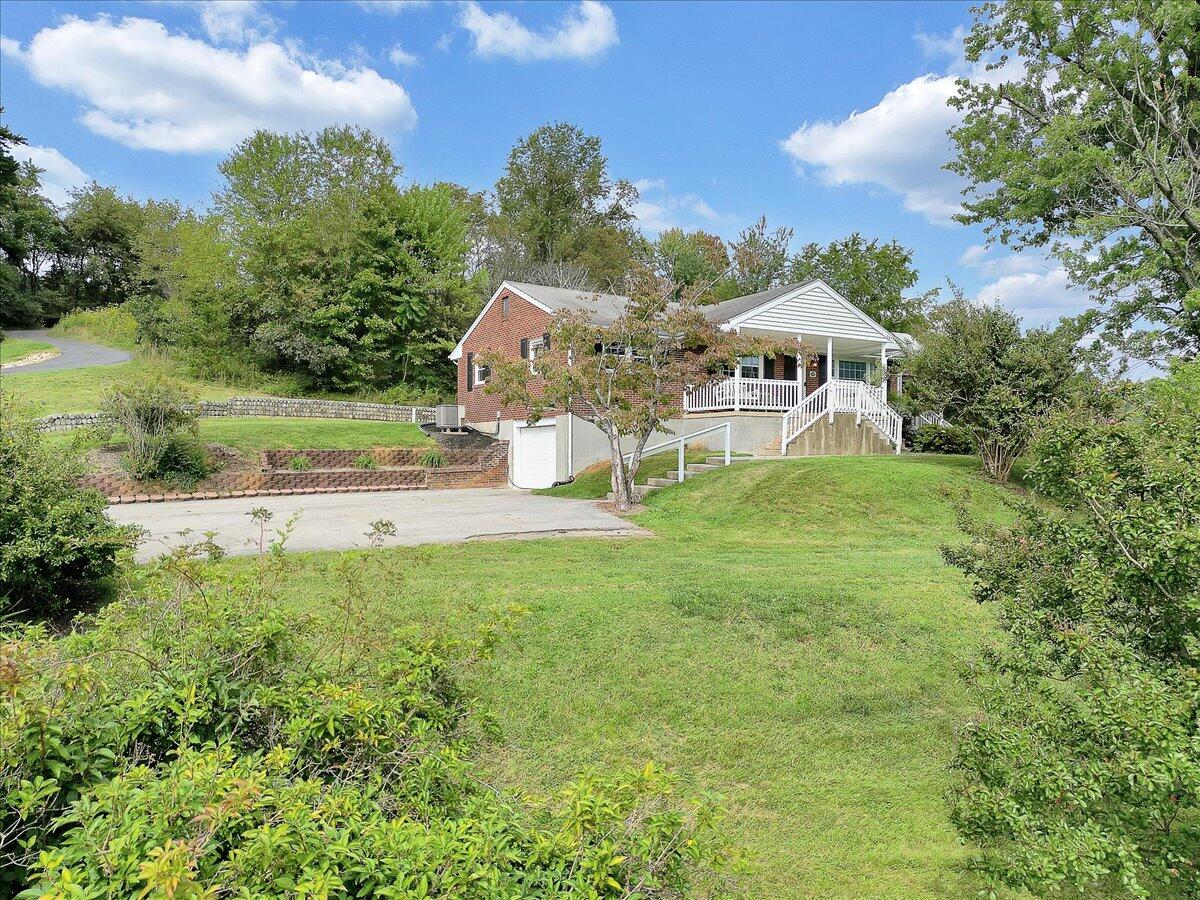 1390 Blue Ridge Springs Road Blue Ridge, VA 24064 - Photo 7 of 54 a view of a house with a yard