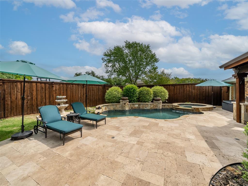 2516 Pepper Tree Circle McKinney, TX 75072 - Photo 13 of 40 Fabulous Pool and perfect place to spend your summer days and nights and the pool is heated so you can actually enjoy it all year!