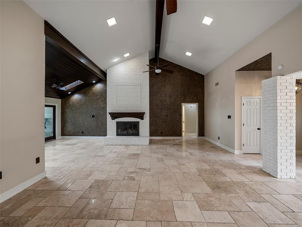 2516 Pepper Tree Circle McKinney, TX 75072 - Photo 14 of 40 Beautiful and bright living room with cathedral ceilings a cozy fireplace and more than enough room to entertain your family and friends. OH, and perfect for the holidays!