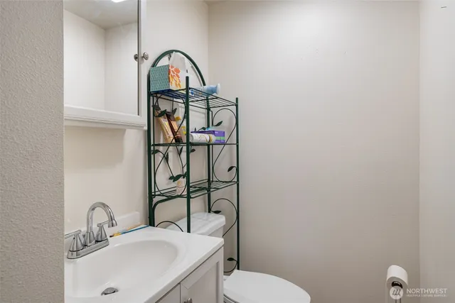 a view of a livingroom with furniture and a flat screen tv