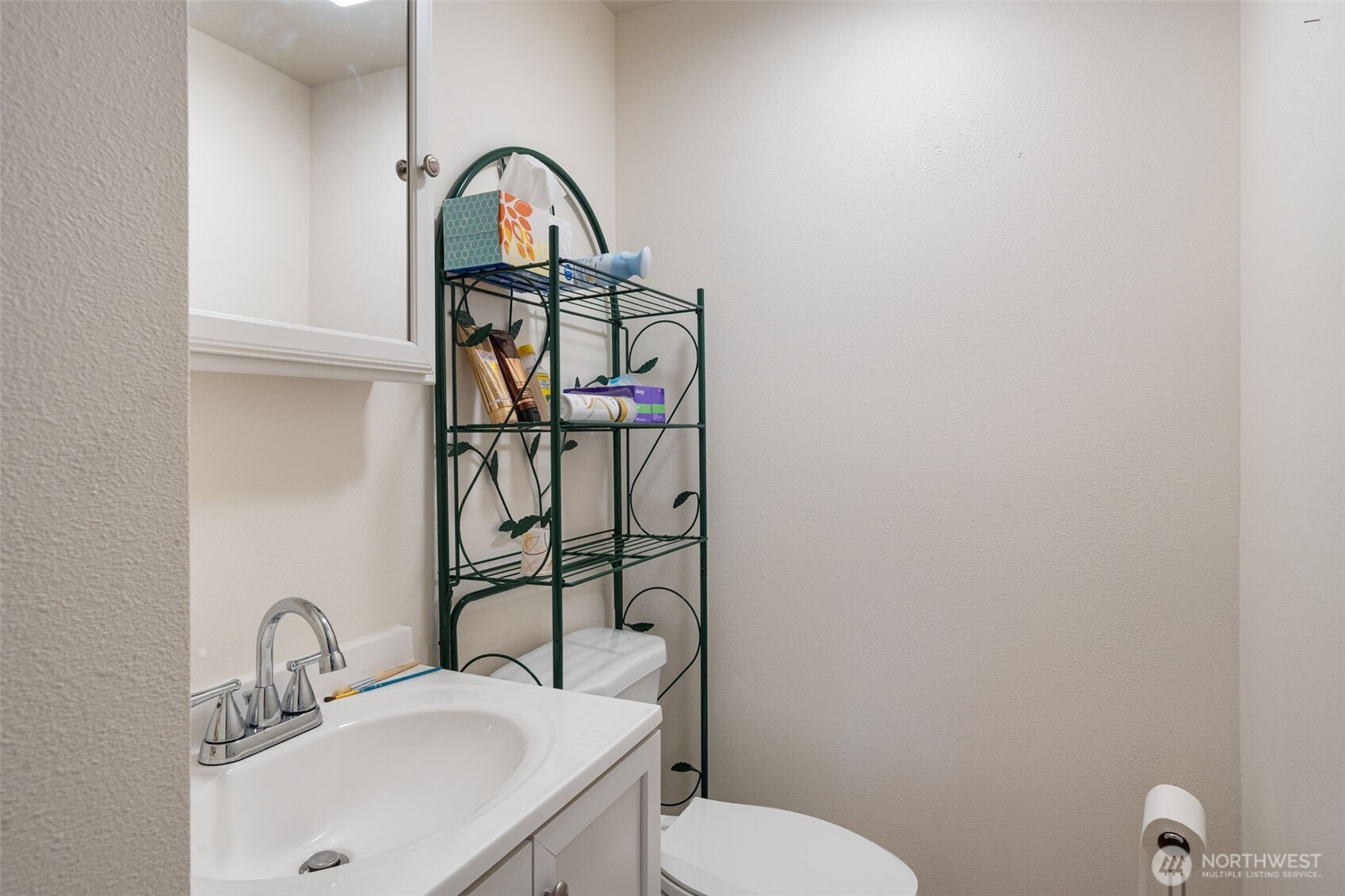 5026 Chico Way Northwest Bremerton, WA 98312 - Photo 17 of 36 a bathroom with a toilet sink and mirror