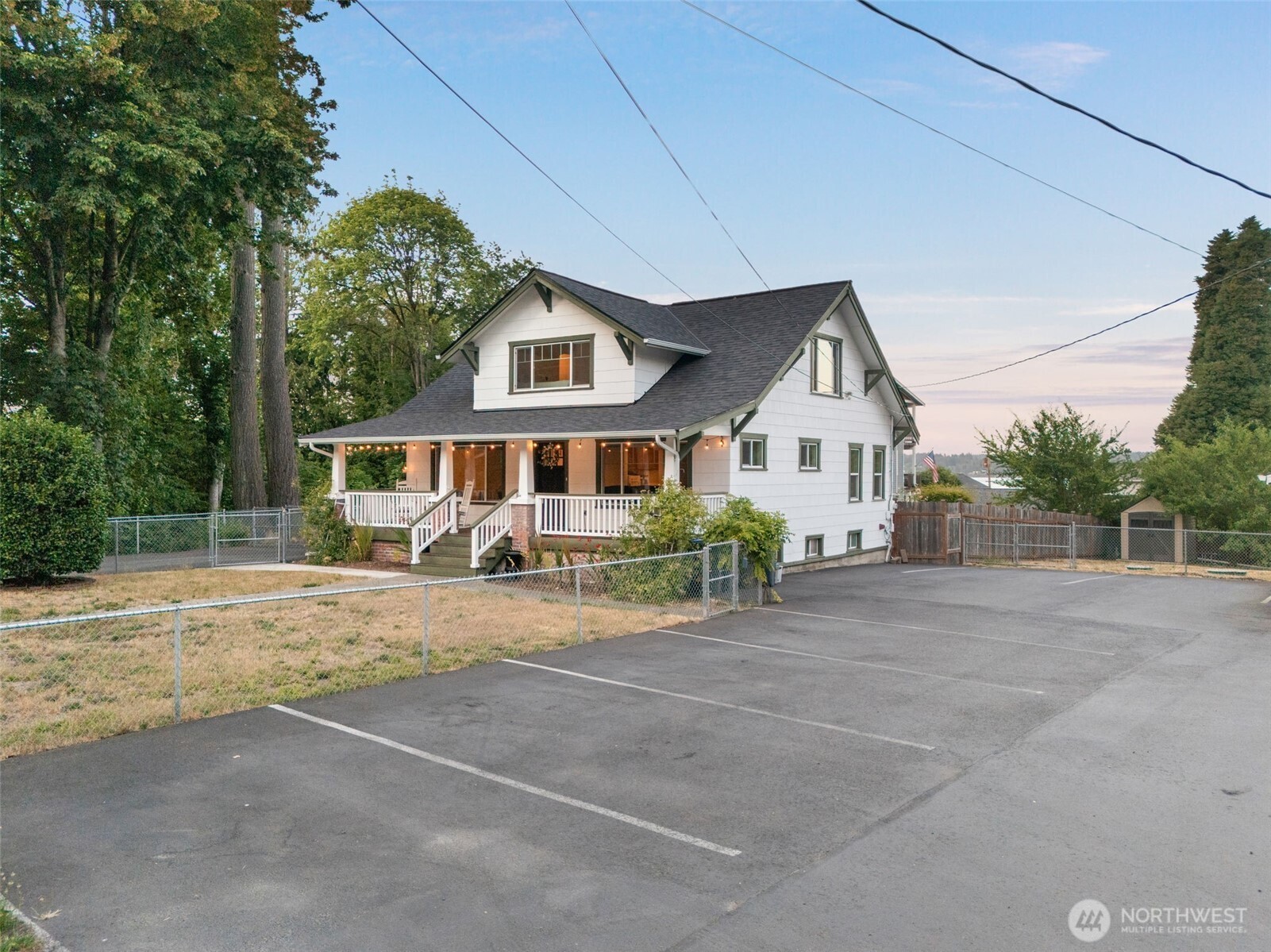 5026 Chico Way Northwest Bremerton, WA 98312 - Photo 2 of 36 a front view of a house with a yard and garage
