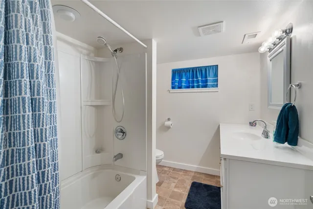 a view of a chair and tables in the balcony