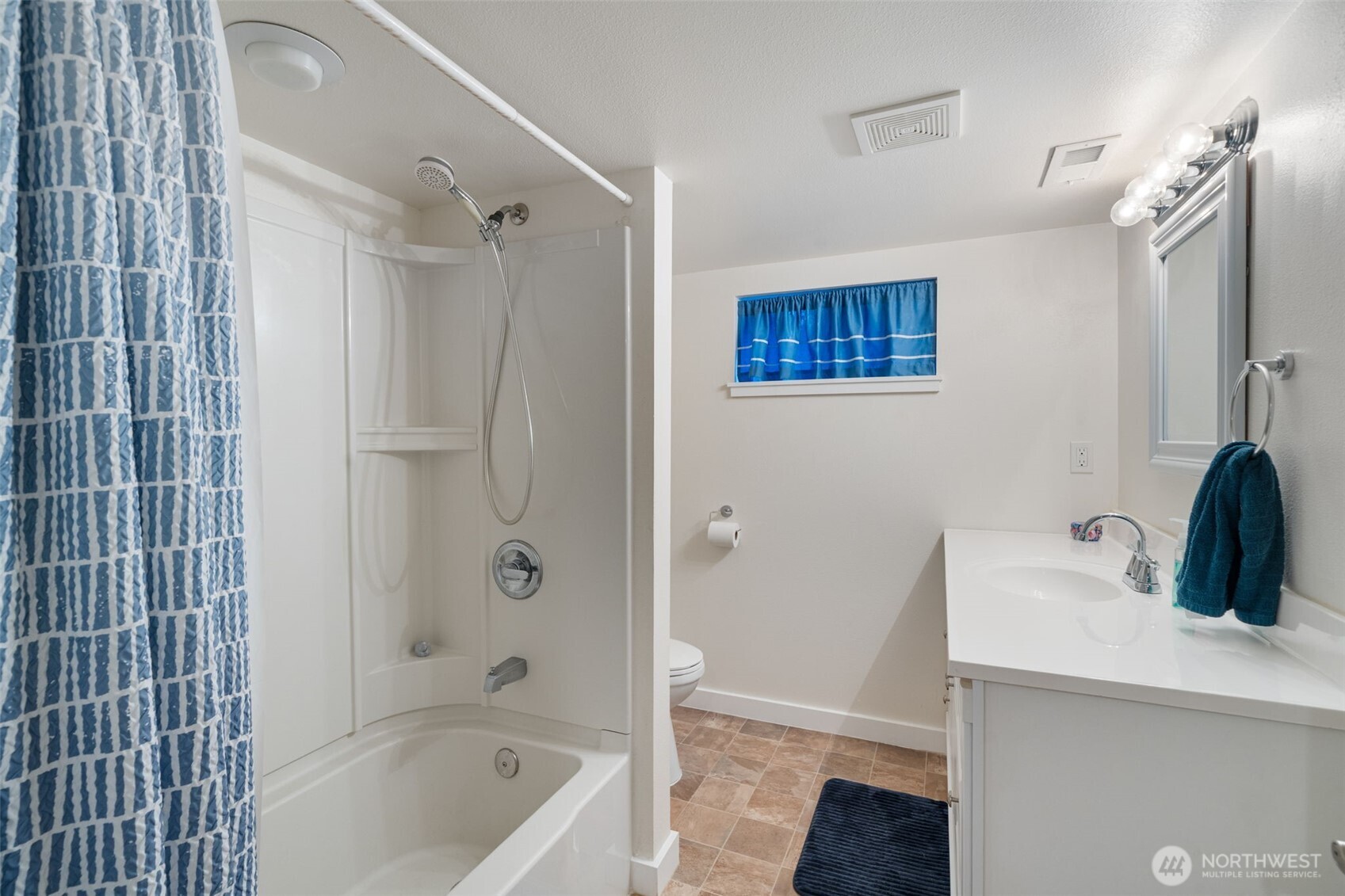 5026 Chico Way Northwest Bremerton, WA 98312 - Photo 21 of 36 a bathroom with a tub sink and mirror
