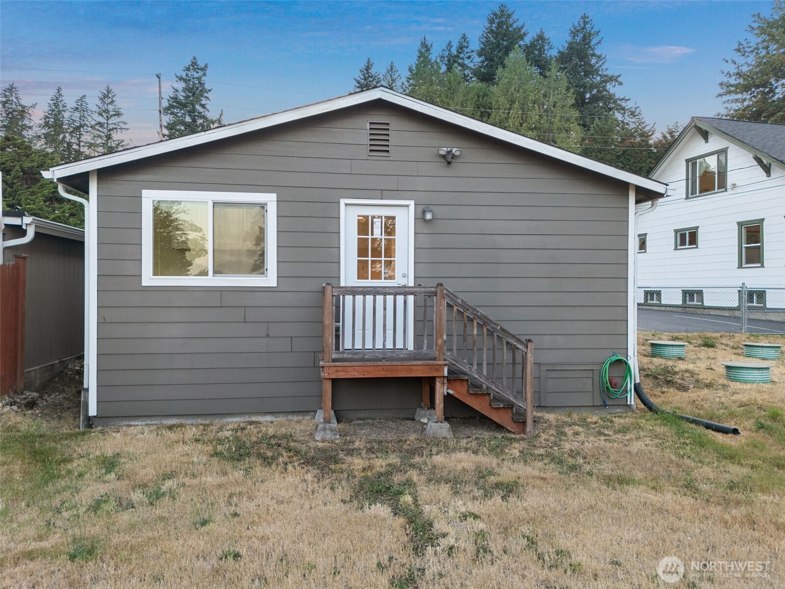 5026 Chico Way Northwest Bremerton, WA 98312 - Photo 28 of 36 a front view of a house with a yard