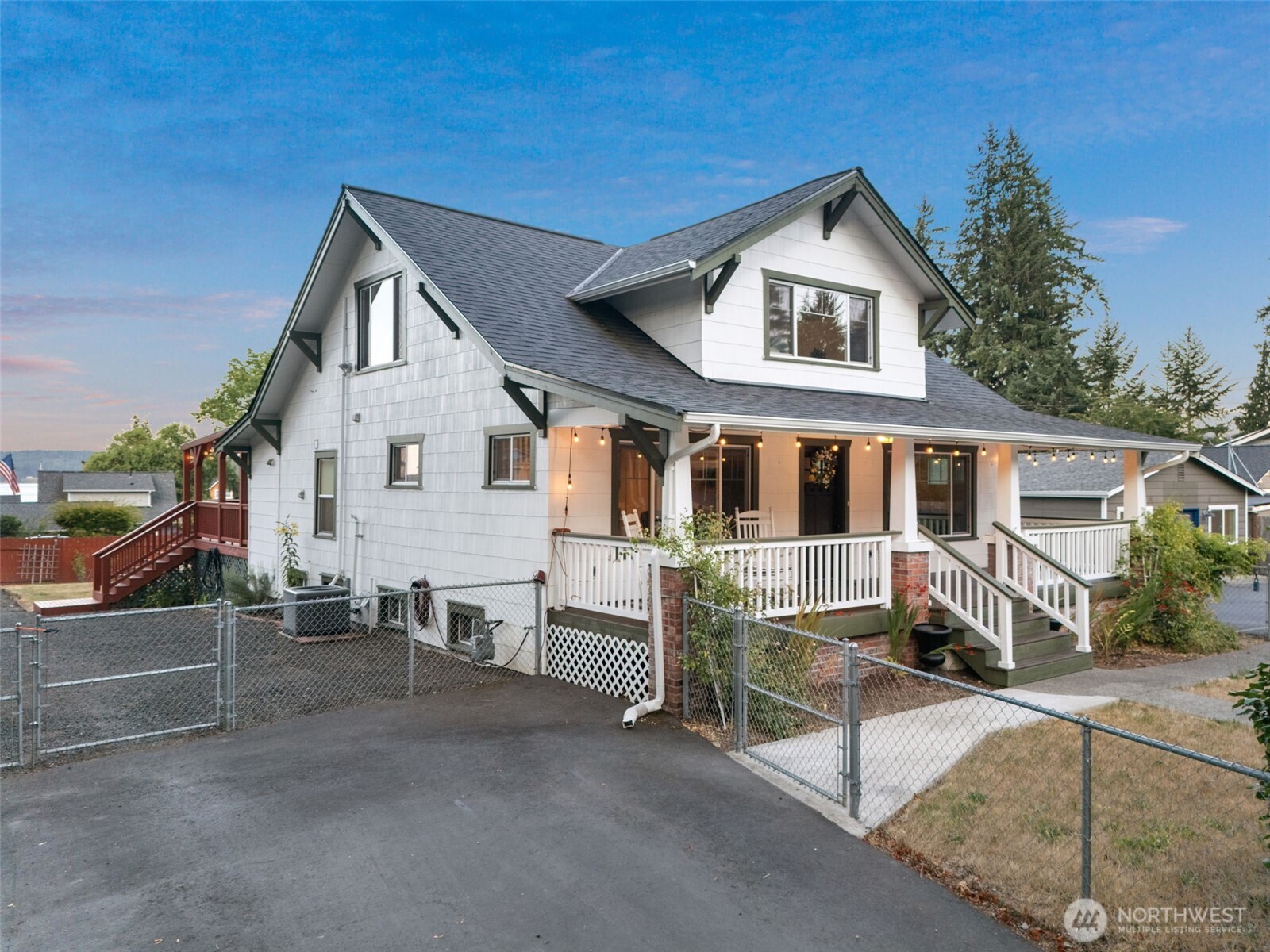 5026 Chico Way Northwest Bremerton, WA 98312 - Photo 3 of 36 a front view of a house with a yard