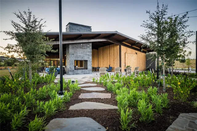 a view of a patio with couches chairs and potted plants