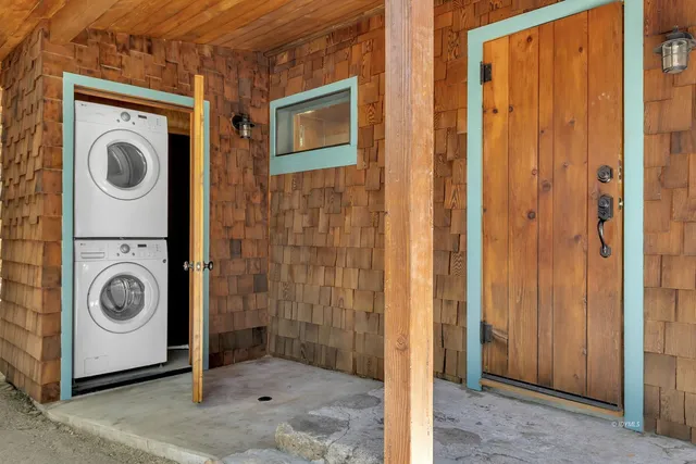 a balcony with wooden floor and fence
